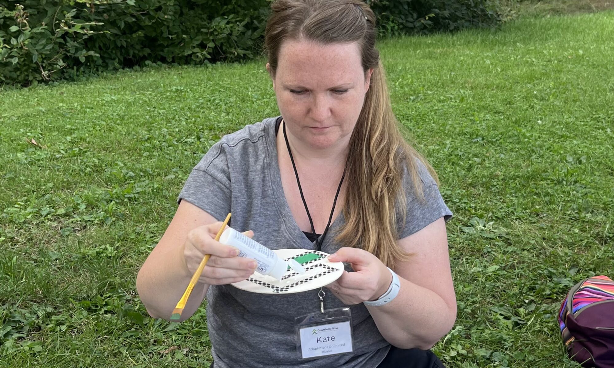 pediatric occupational therapist that works outdoors with kids doing a nature-inspired crafted at the retreat